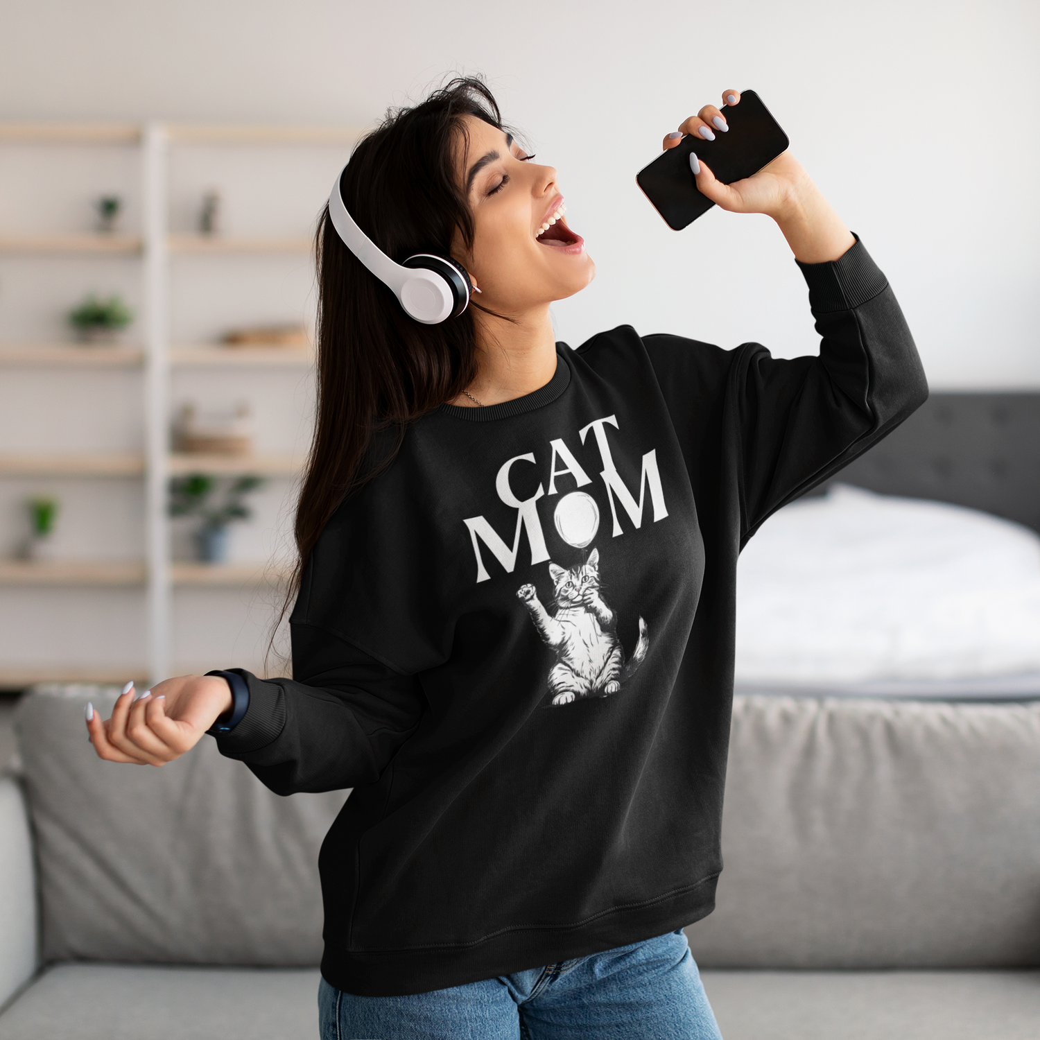 Black sweatshirt with white cat holding balloon featuring white text Cat mom.