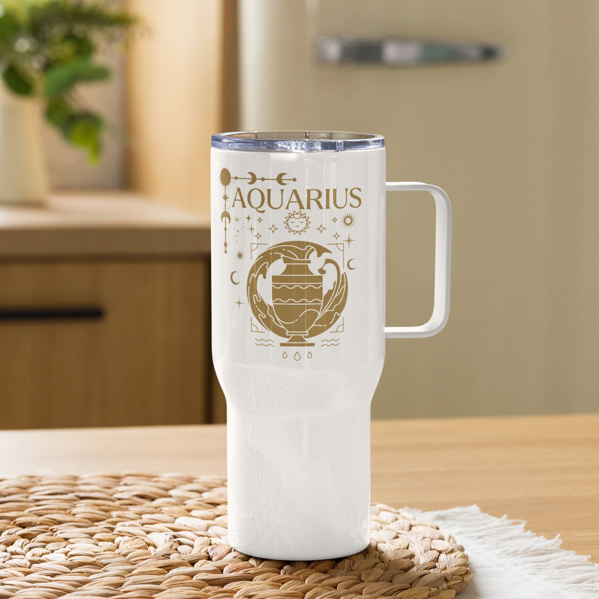 White travel mug with handle, featuring an Aquarius-themed design in brown tones. The design includes a stylized water-bearer symbol with celestial elements like stars, moons, and planetary symbols. The word 'Aquarius' is prominently displayed at the top, showcasing an astrology-inspired aesthetic.