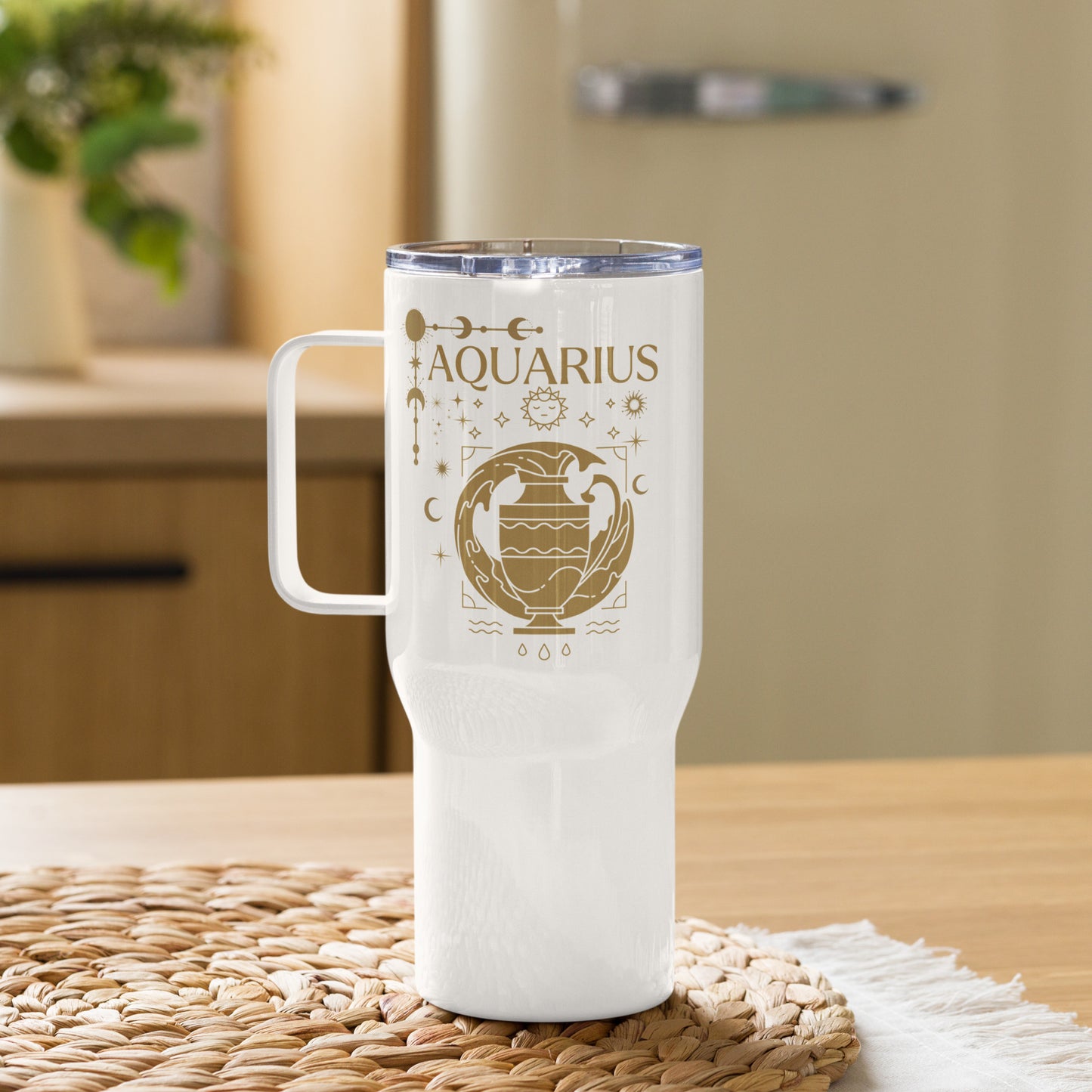 White travel mug with handle, featuring an Aquarius-themed design in brown tones. The design includes a stylized water-bearer symbol with celestial elements like stars, moons, and planetary symbols. The word 'Aquarius' is prominently displayed at the top, showcasing an astrology-inspired aesthetic.