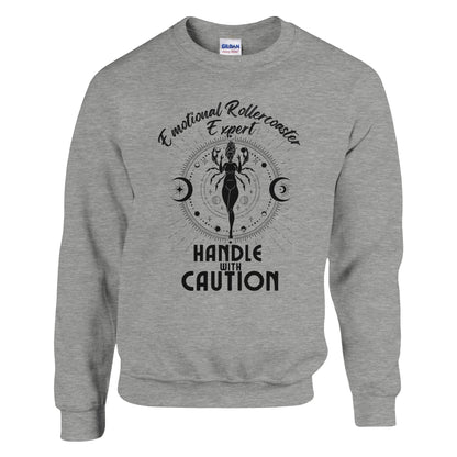 Ash cancer zodiac sweatshirt with 'Emotional Rollercoaster Expert' and 'Handle with Caution' text; design features Cancer symbol with celestial elements, showcasing a playful take on Cancer traits.