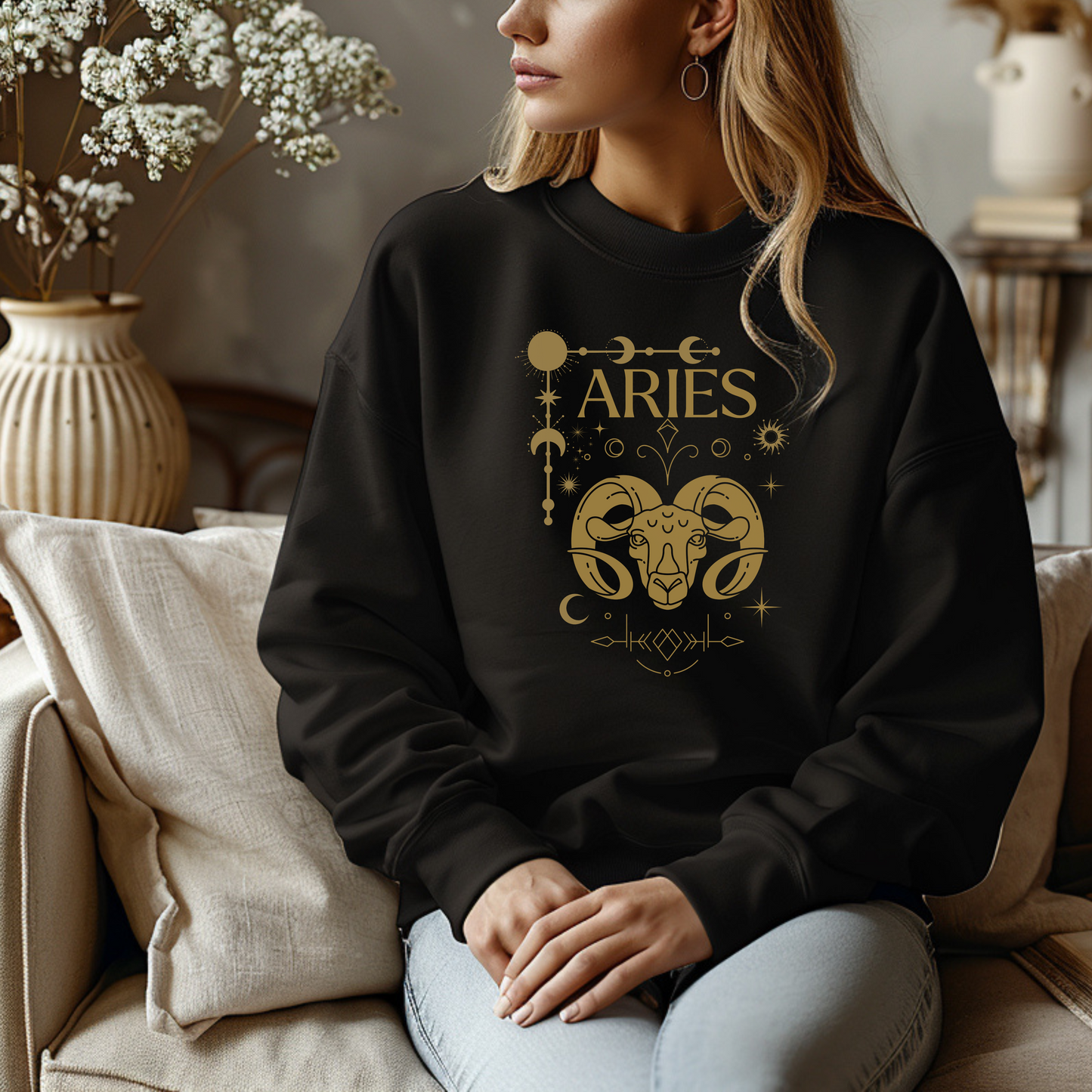 Black Aries sweatshirt with brown Aries symbol, zodiac signs, and celestial details.