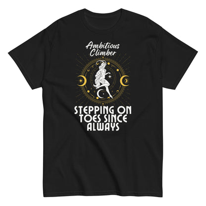 Front of black Capricorn-themed t-shirt with 'Ambitious Climber' text, illustration of Capricorn symbol, and phrase 'Stepping on Toes Since Always.