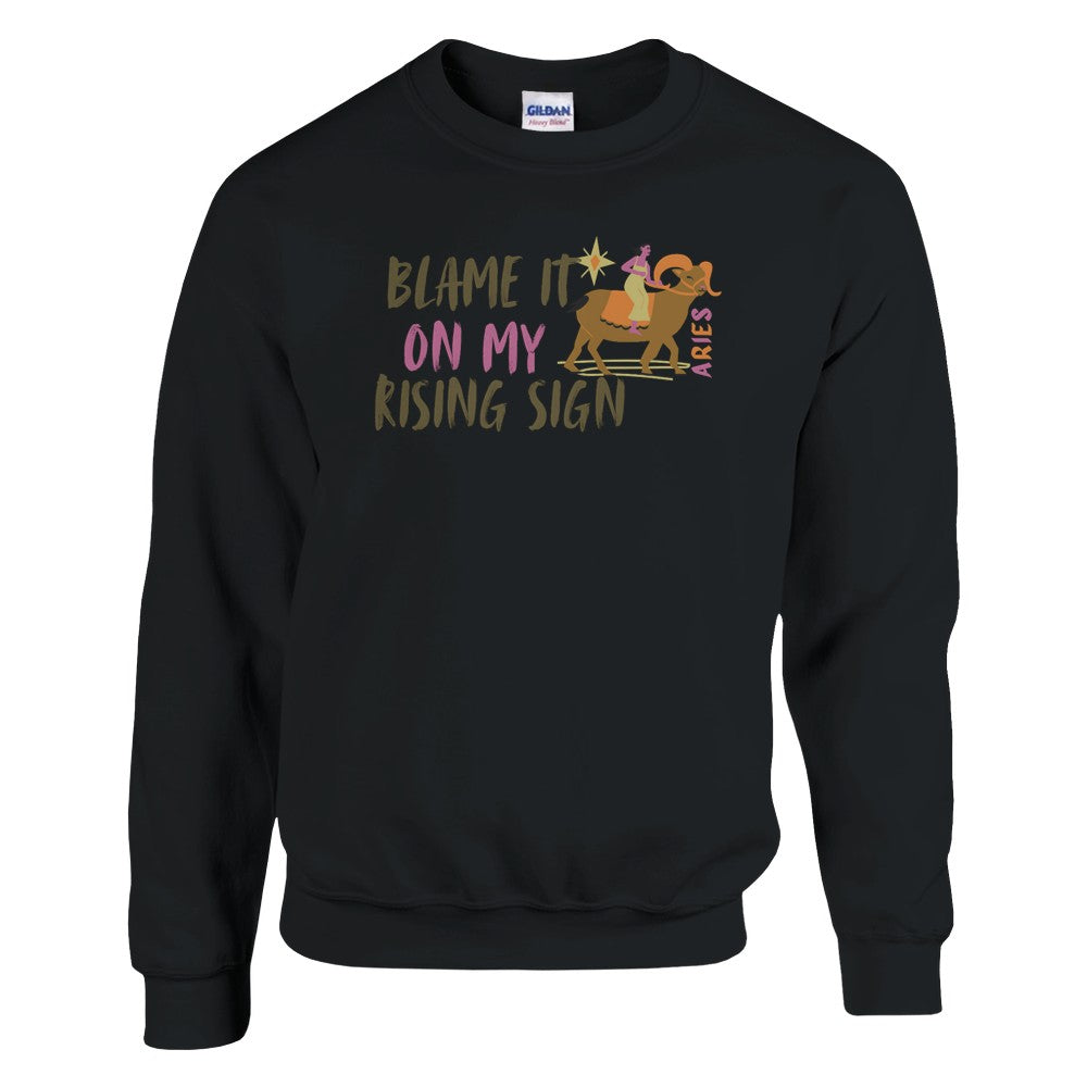 Black sweatshirt with 'Blame It On My Rising Sign' text and colorful Aries design.