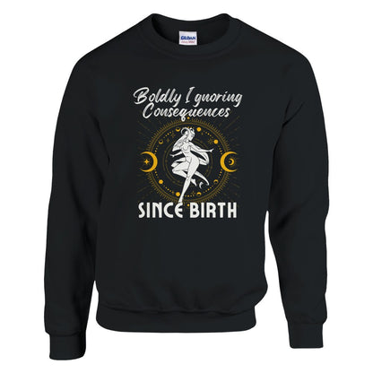 Black sweatshirt with 'Boldly Ignoring Consequences Since Birth' text and white and yellow celestial illustration.