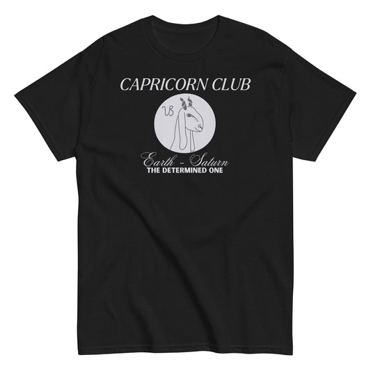 Front of black Capricorn-themed t-shirt with 'Capricorn Club' text, Capricorn symbol illustration, and phrase 'Earth - Saturn, The Determined One.