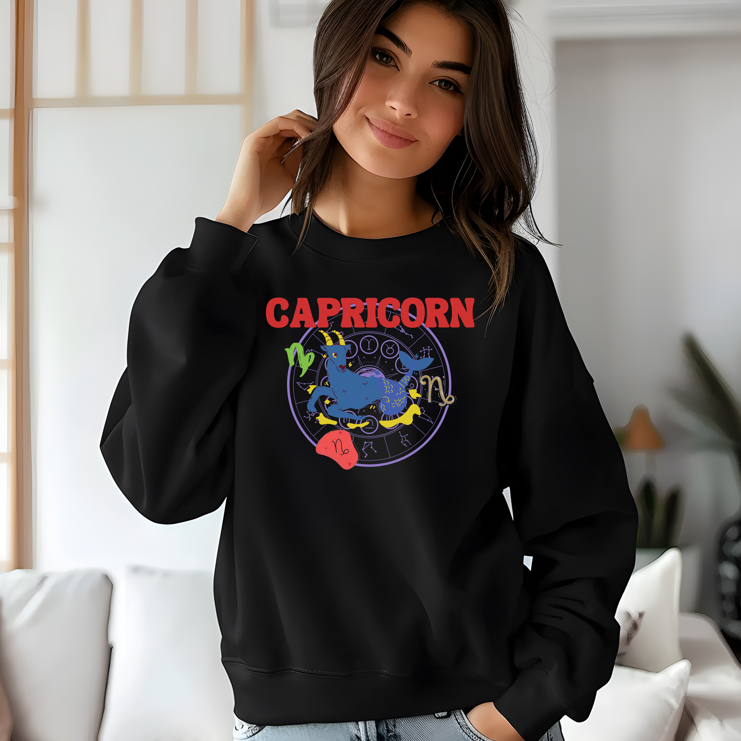 Front of black Capricorn-themed sweatshirt with colorful astrology design featuring Capricorn symbol and zodiac elements.