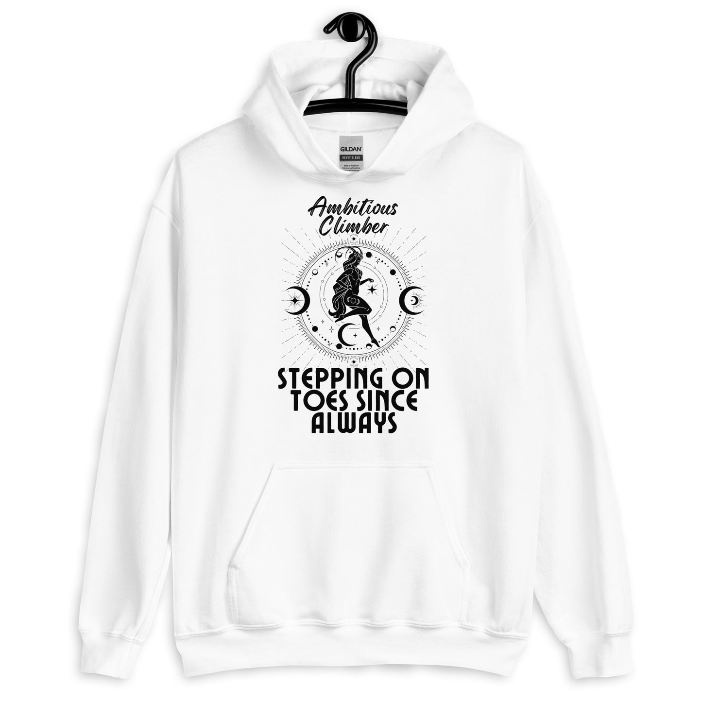 Front of white Capricorn-themed hoodie with retro design, featuring text 'Ambitious Climber' above an illustration of a determined figure, surrounded by celestial symbols, and 'Stepping on Toes Since Always' below.