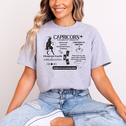 Front of sport grey Capricorn-themed t-shirt with retro design, featuring astrological details including 'Element: Earth,' 'Ruling planet: Saturn,' and descriptive text about Capricorn traits such as determination, practicality, and ambition.