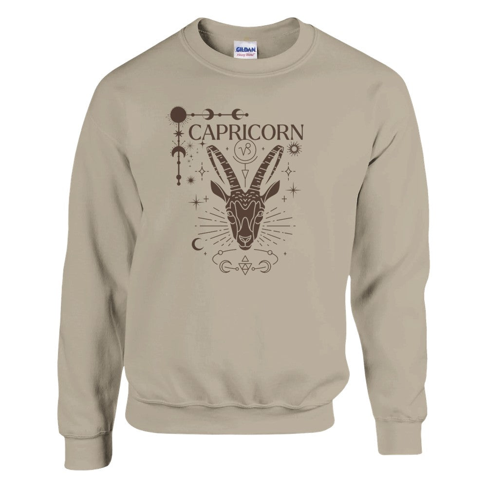 Front of sand Capricorn-themed sweatshirt featuring a glamorous illustration of a goat symbol with celestial and ornate details.