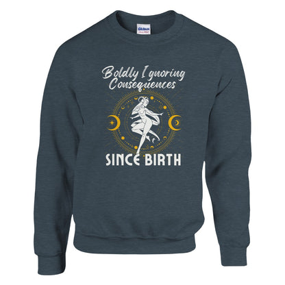 Dark Heather sweatshirt with 'Boldly Ignoring Consequences Since Birth' text and white and yellow celestial illustration