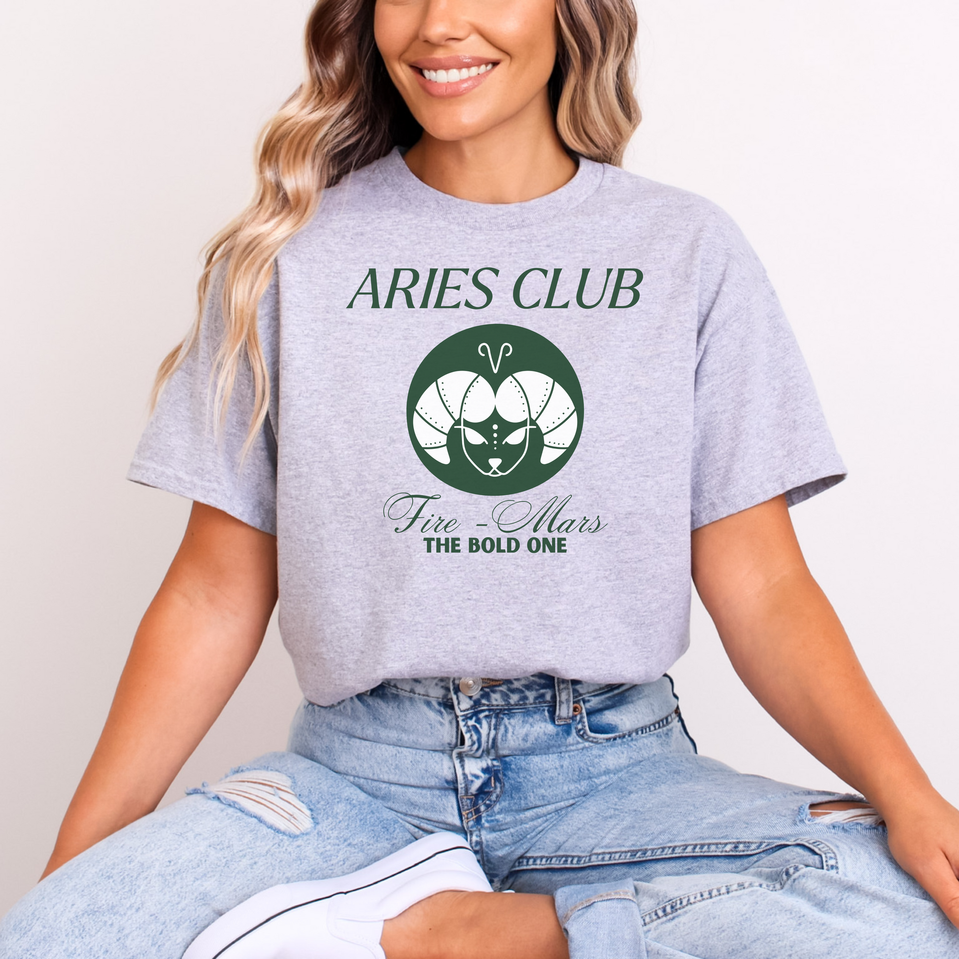 Grey Aries Club t-shirt with green zodiac ram design, Fire element, Mars ruling planet, and text 'The Bold One