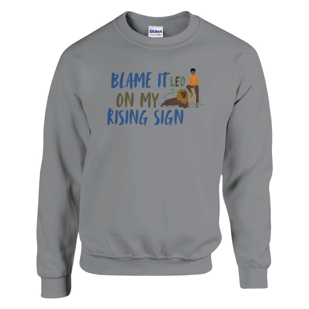 Front of sport grey sweatshirt with Leo-themed design, text 'Blame It On My Rising Sign' featuring a person and a lion illustration.