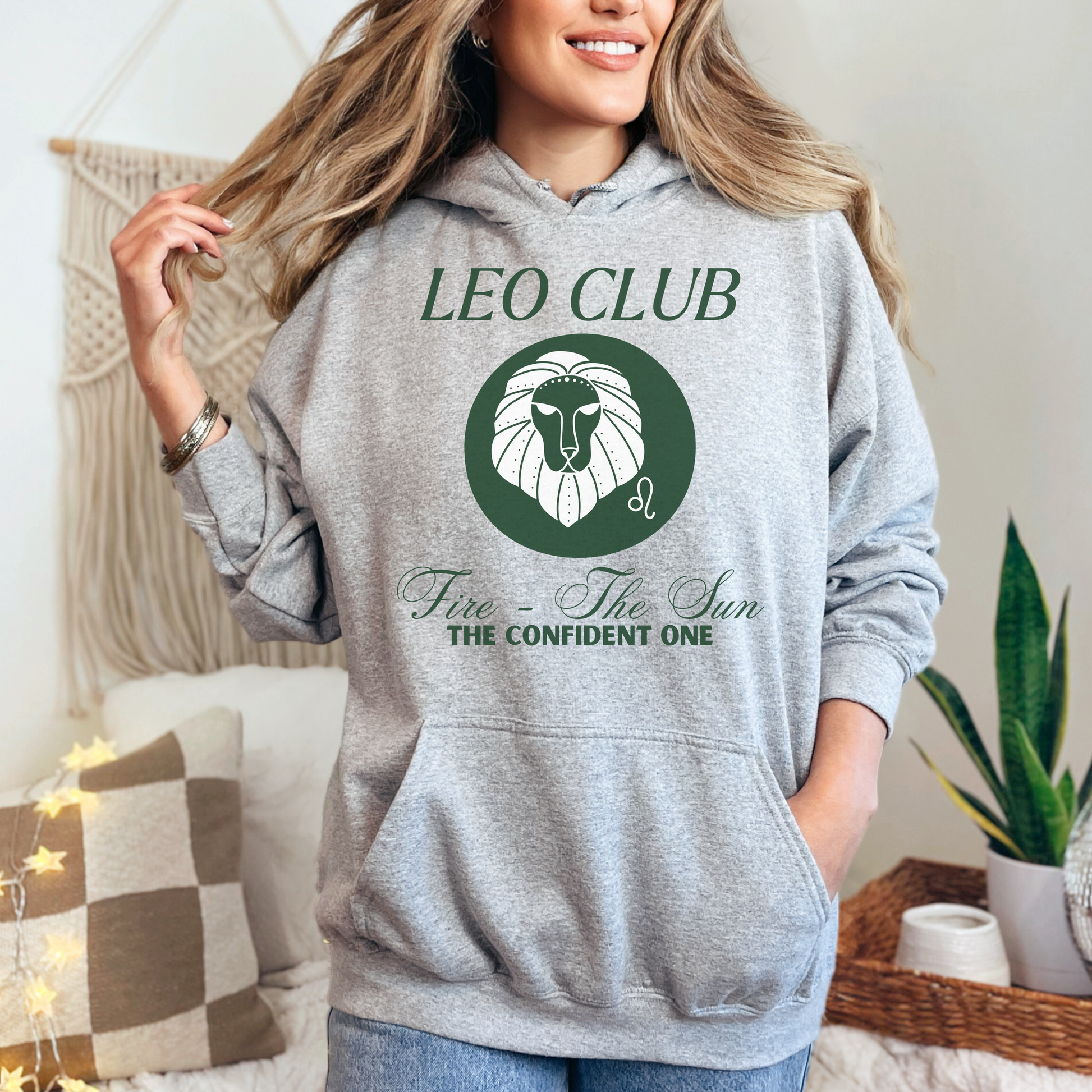 Front of sport grey hoodie with Leo-themed design, text 'Leo Club - Fire - The Sun - The Confident One' featuring a lion illustration.