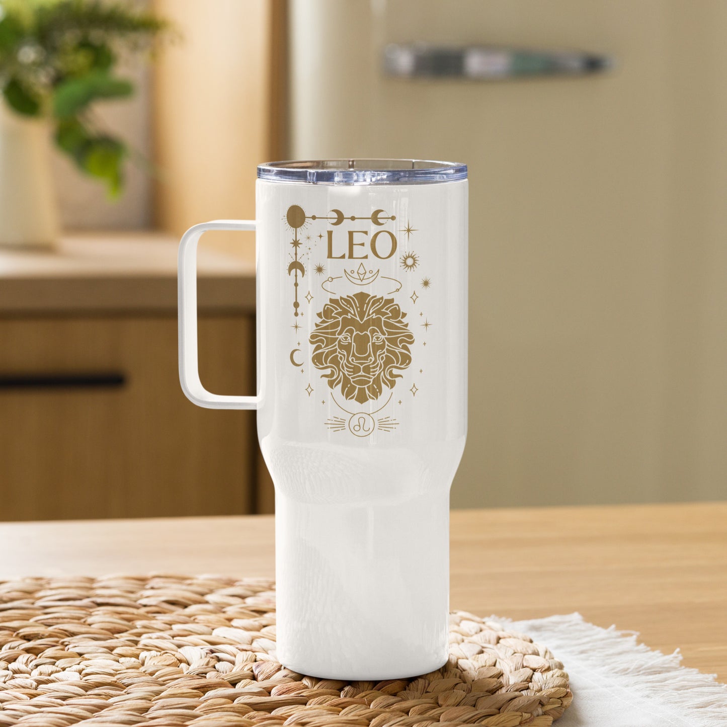 White travel mug with handle featuring Leo design in brown tones, including Leo symbol and celestial elements.