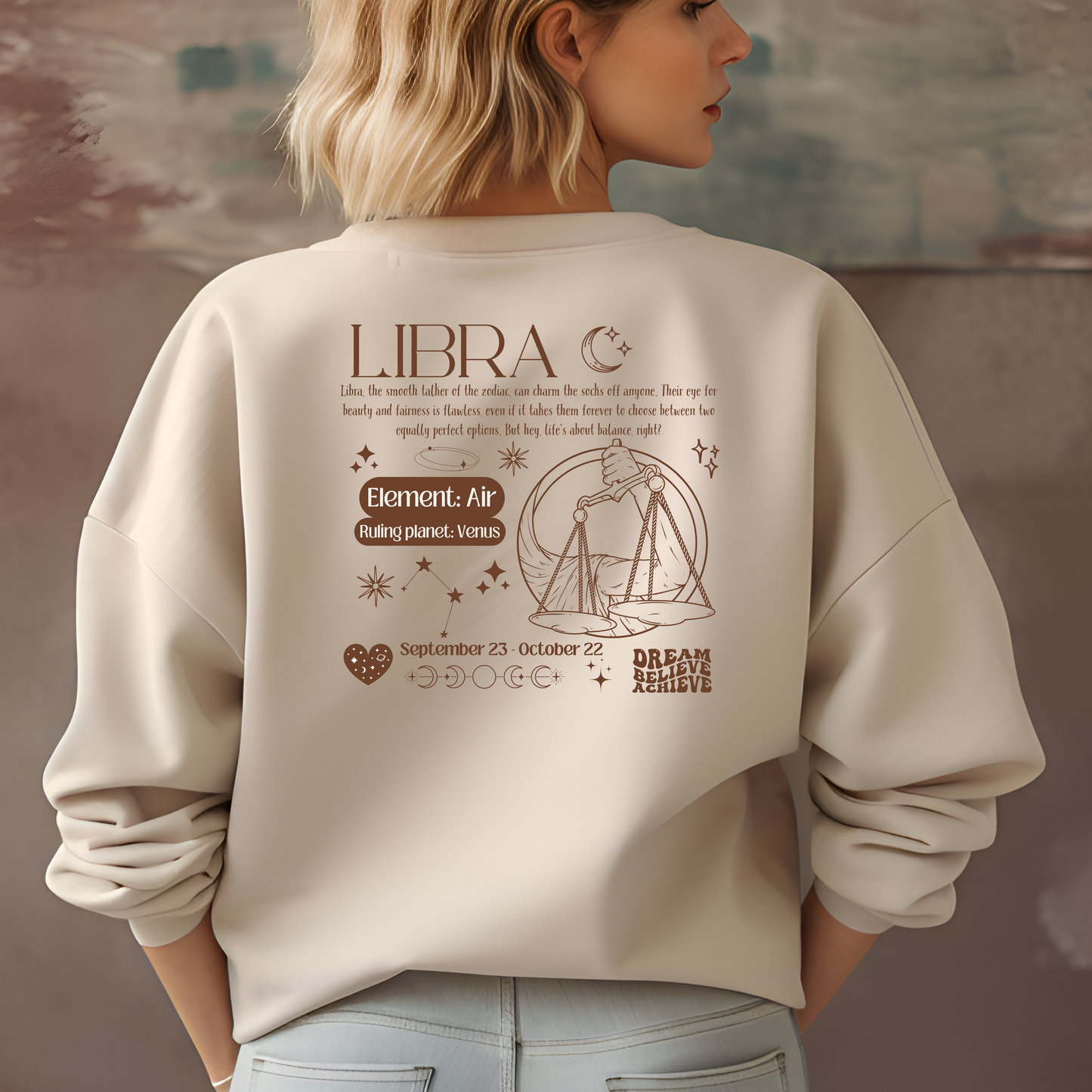 Sand Libra sweatshirt with retro-style back design featuring Libra scales illustration, zodiac traits, and symbols in brown.