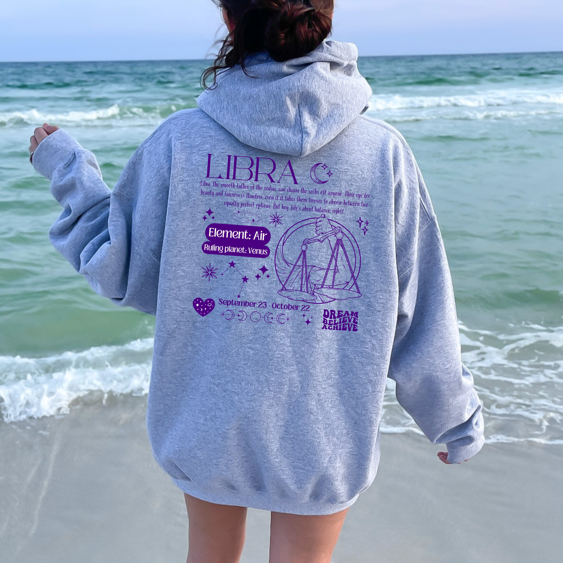 Sport grey Libra hoodie with back design featuring scales illustration, zodiac traits, and 'Libra' text in purple retro style.