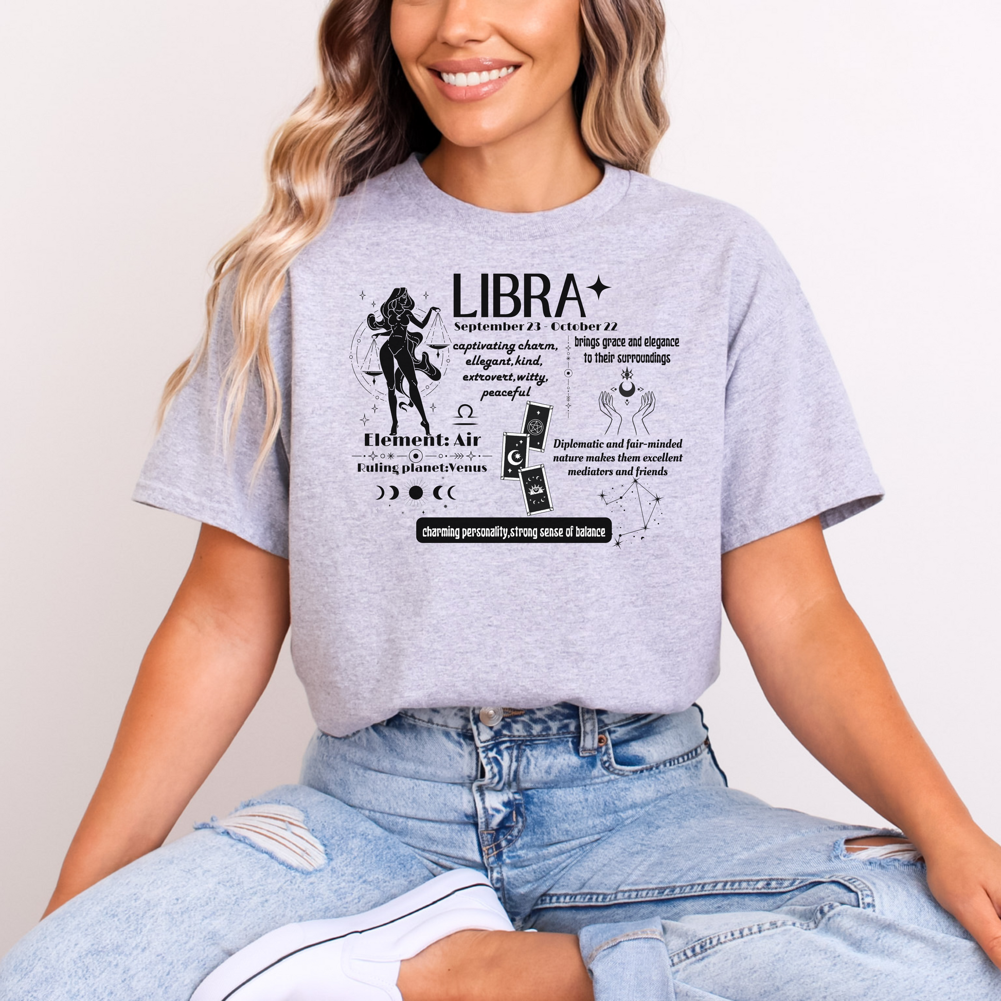 Front of sport grey Libra t-shirt with astrological traits, including charm, balance, and elegance, featuring symbols for element Air and ruling planet Venus.