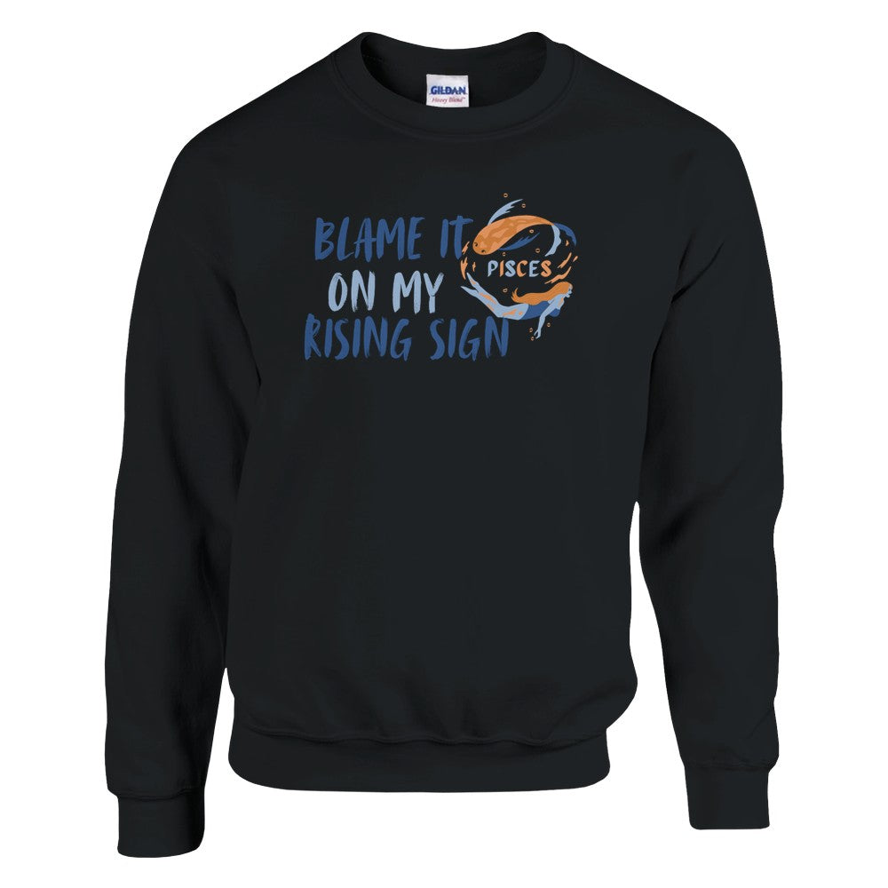 Black Pisces sweatshirt with 'Blame it on my rising sign' text and colorful Pisces symbol illustration.