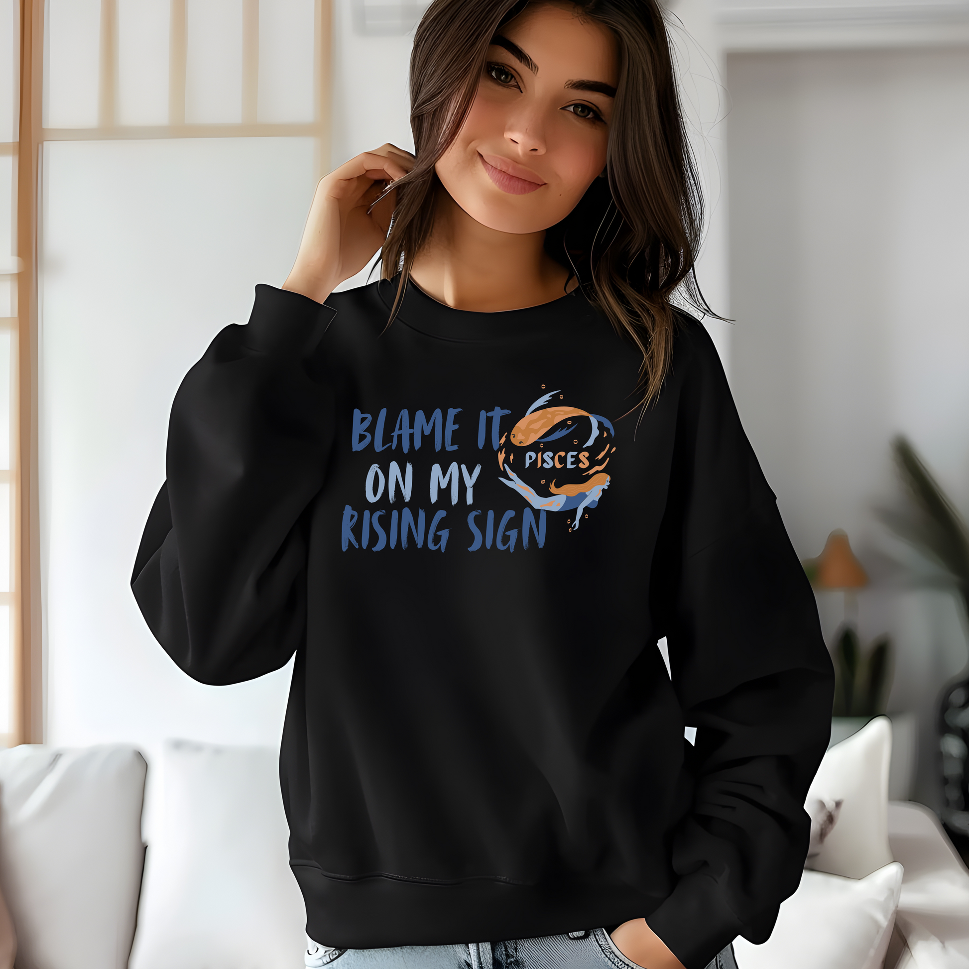 Black Pisces sweatshirt with 'Blame it on my rising sign' text and colorful Pisces symbol illustration.