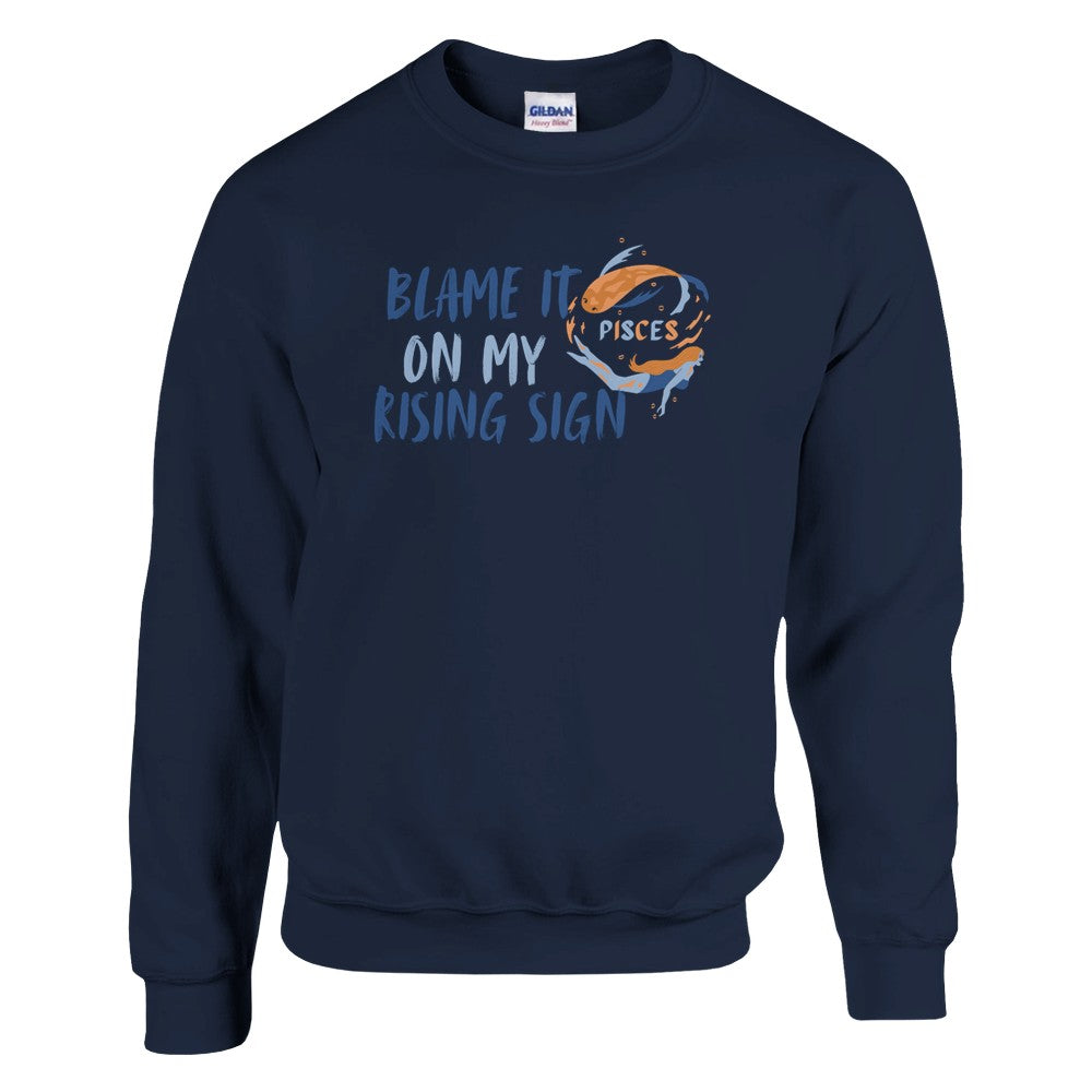 Navy blue Pisces sweatshirt with 'Blame it on my rising sign' text and colorful Pisces symbol illustration.