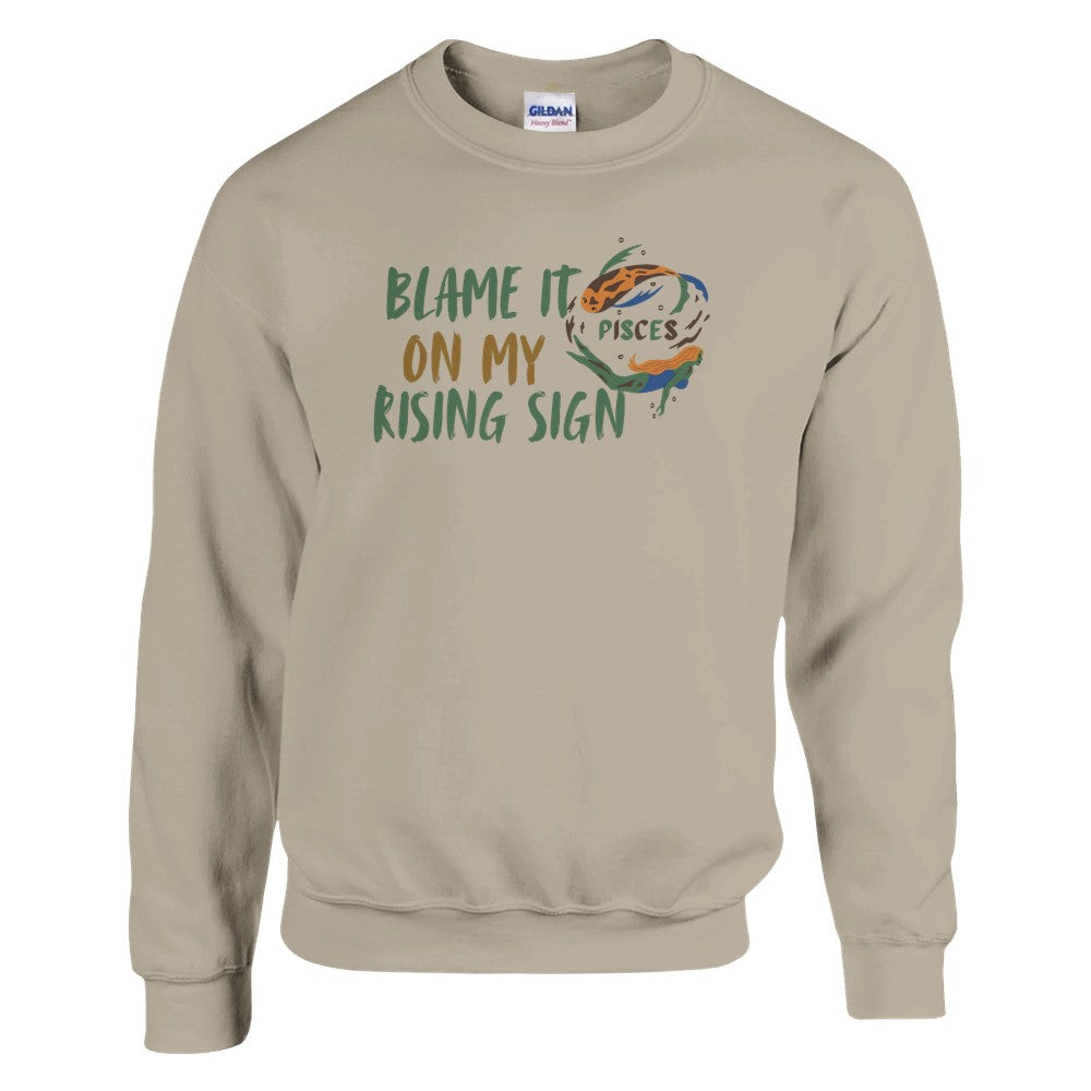 Sand Pisces sweatshirt with 'Blame it on my rising sign' text and colorful Pisces symbol illustration.