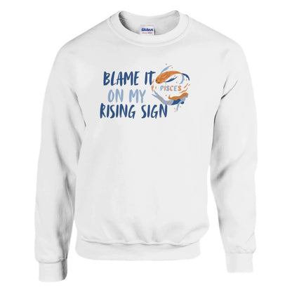 White Pisces sweatshirt with 'Blame it on my rising sign' text and colorful Pisces symbol illustration.