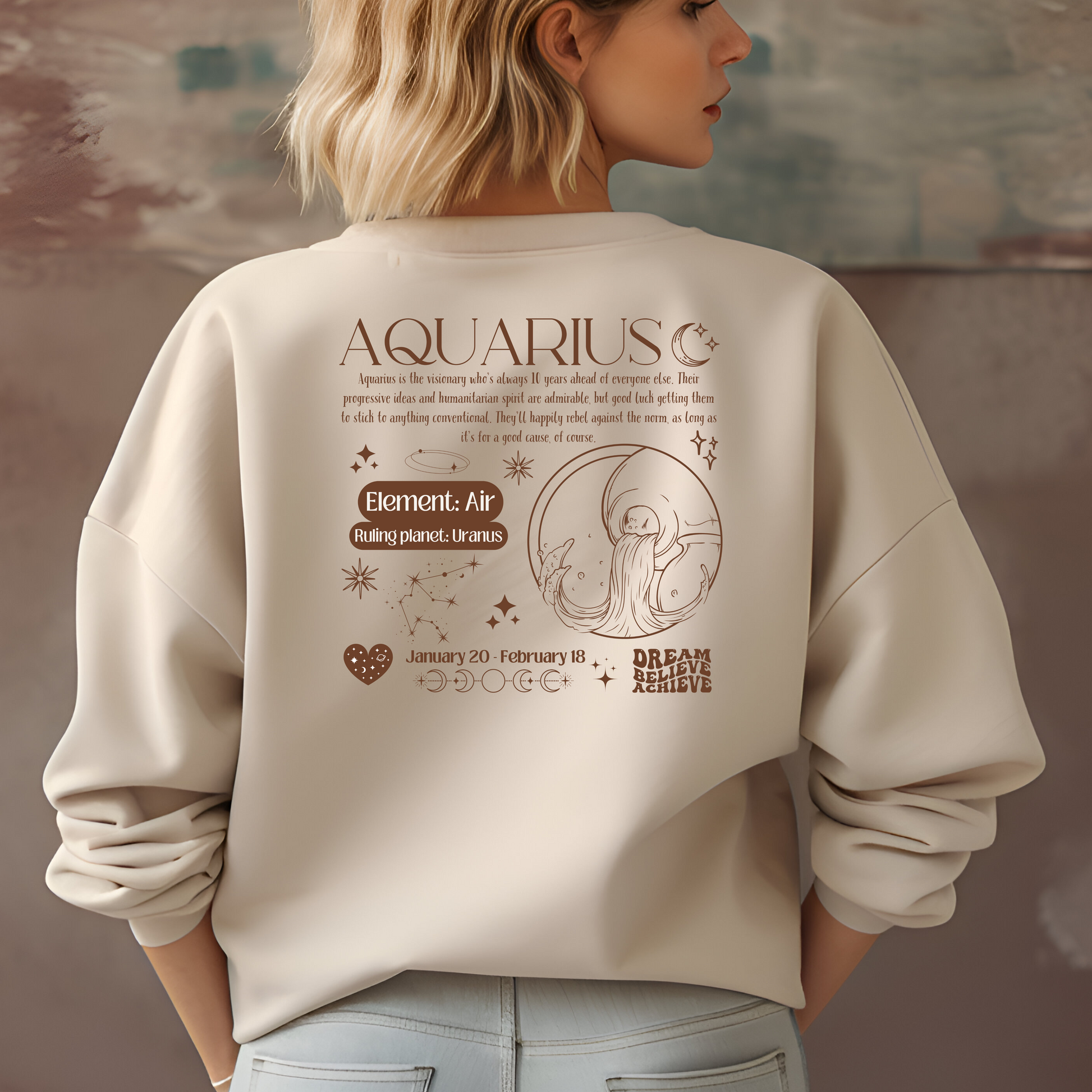 Back of sand Aquarius sweatshirt with dark brown zodiac design, featuring Aquarius symbol, Air element, Uranus ruling planet, and inspirational text.