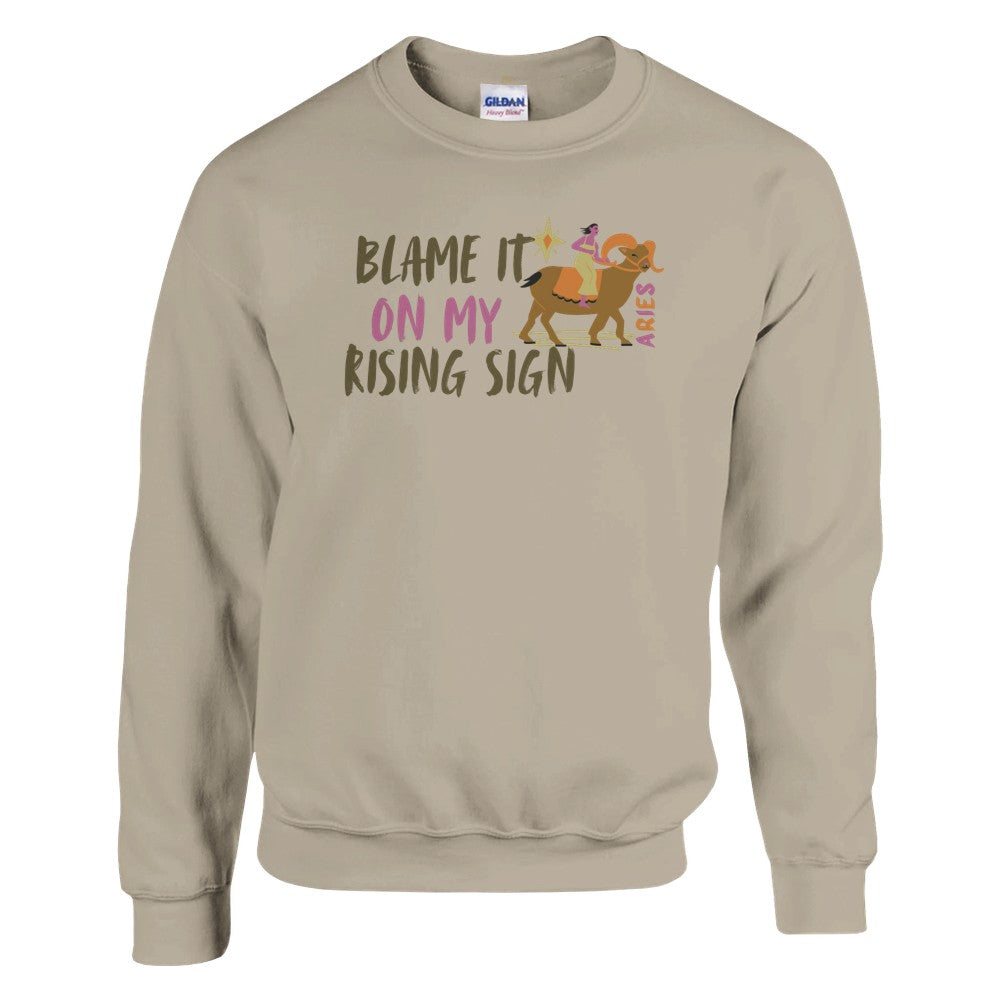 Sand sweatshirt with 'Blame It On My Rising Sign' text and colorful Aries design.