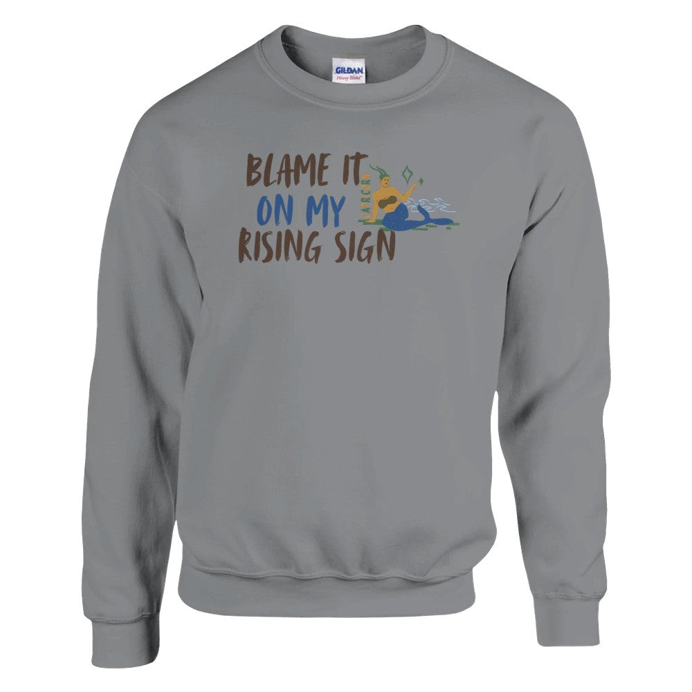 Front of sport grey Capricorn-themed sweatshirt with 'Blame It On My Rising Sign' text and illustration of Capricorn zodiac symbol.