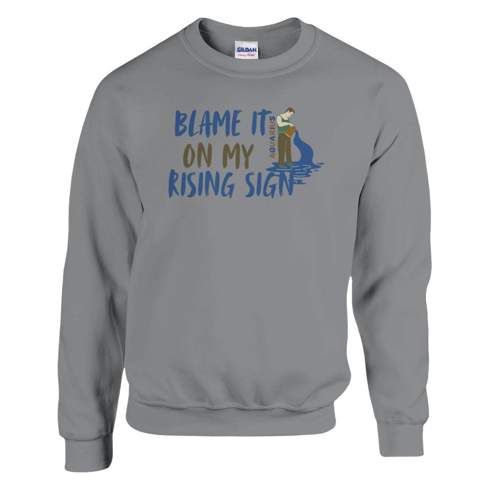 Sport grey Aquarius sweatshirt with 'Blame It On My Rising Sign' text and colorful Aquarius water-bearer illustration in blue and brown tones.