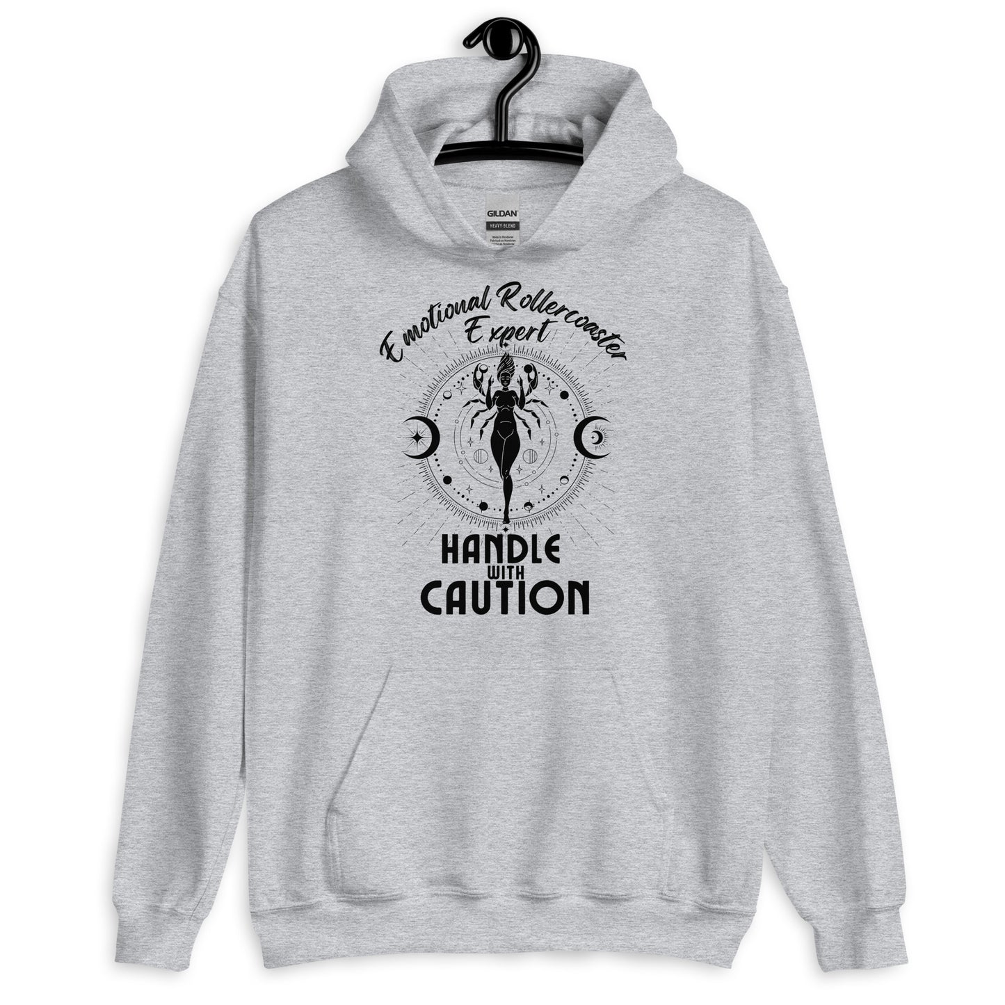 Sport grey hoodie featuring a Cancer zodiac-themed design with the phrase 'Emotional Rollercoaster Expert' at the top and 'Handle With Caution' at the bottom. The central illustration depicts a stylized figure surrounded by celestial symbols, including moons and stars, with a mystical, radiant backdrop in black accents.