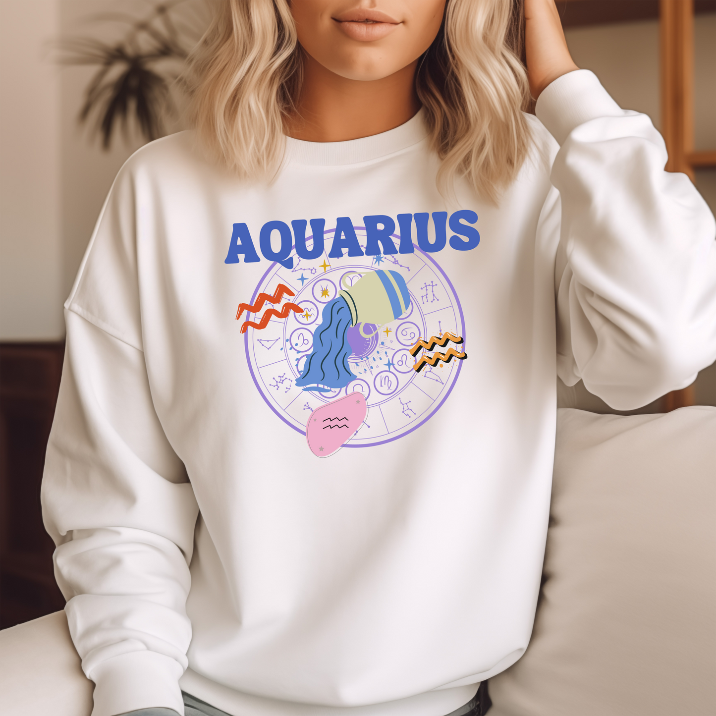 White Aquarius sweatshirt with colorful Aquarius symbol, zodiac wheel, and bold 'Aquarius' text.