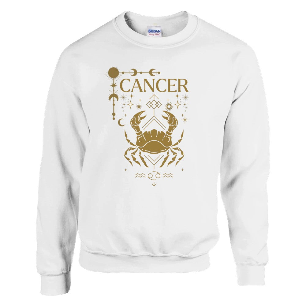 White sweatshirt featuring a Cancer zodiac design in a brownish-gold color. The central illustration shows a stylized crab with intricate celestial symbols, stars, and decorative accents surrounding it. The word 'Cancer' is displayed above, and the Cancer zodiac symbol appears below, giving the design a mystical and astrological aesthetic.