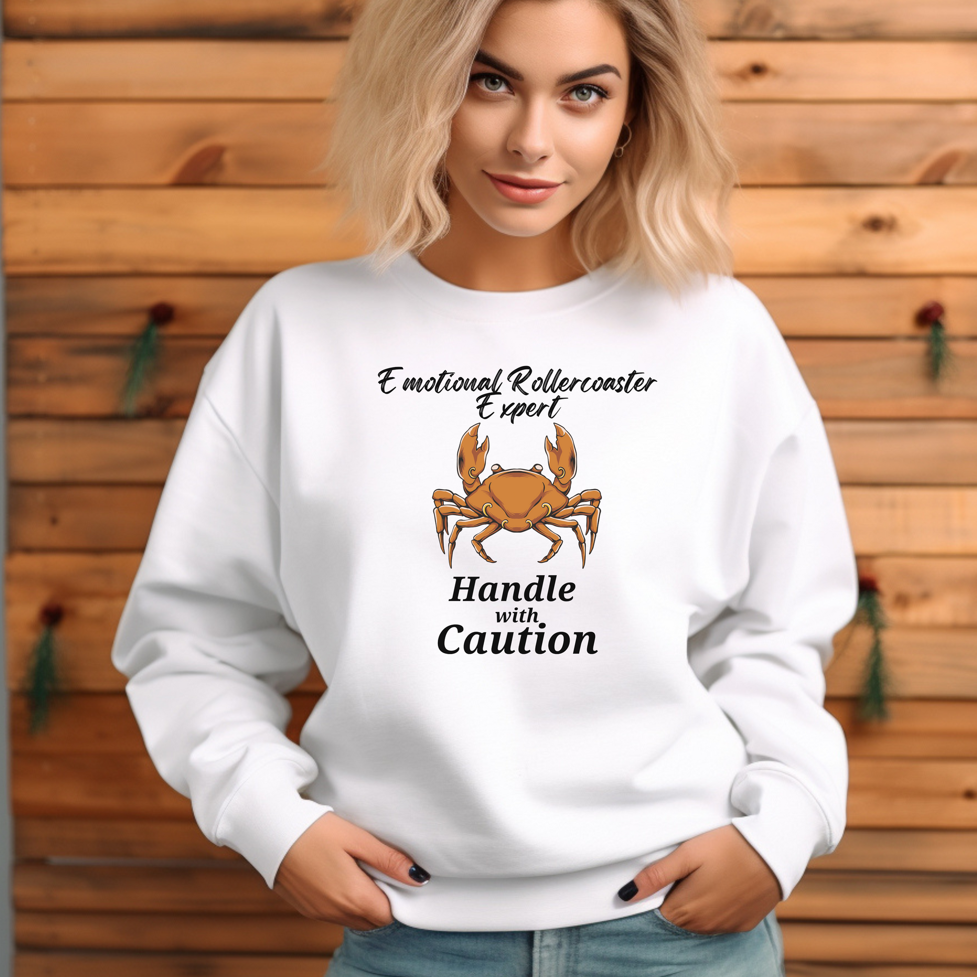 Front of white Cancer-themed sweatshirt with crab illustration and 'Emotional Rollercoaster Expert - Handle with Caution' text.